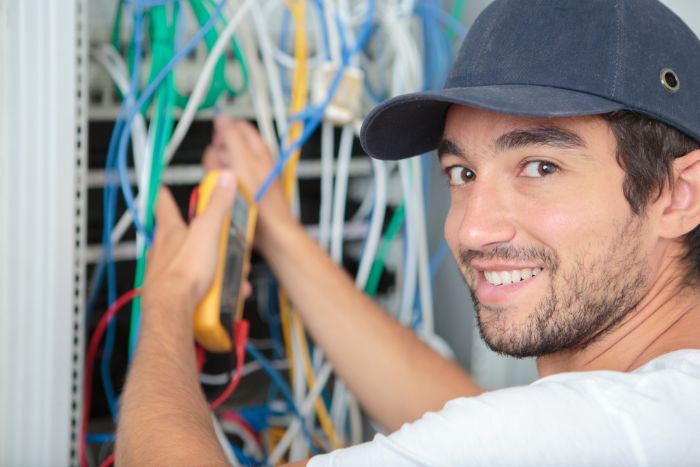 Picture of handyman repairing an electrical issue in San Bernardino